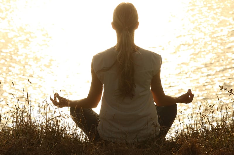 Woman meditating in lotus pose